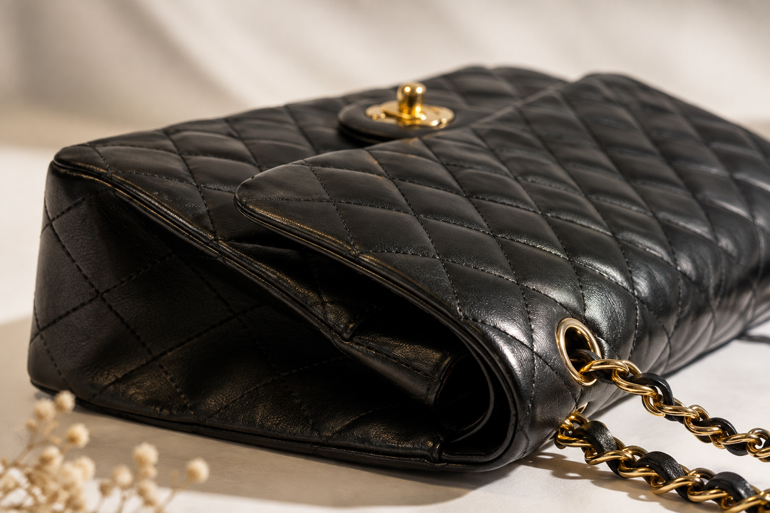 Stitching and weighted hardware on an authentic designer bag