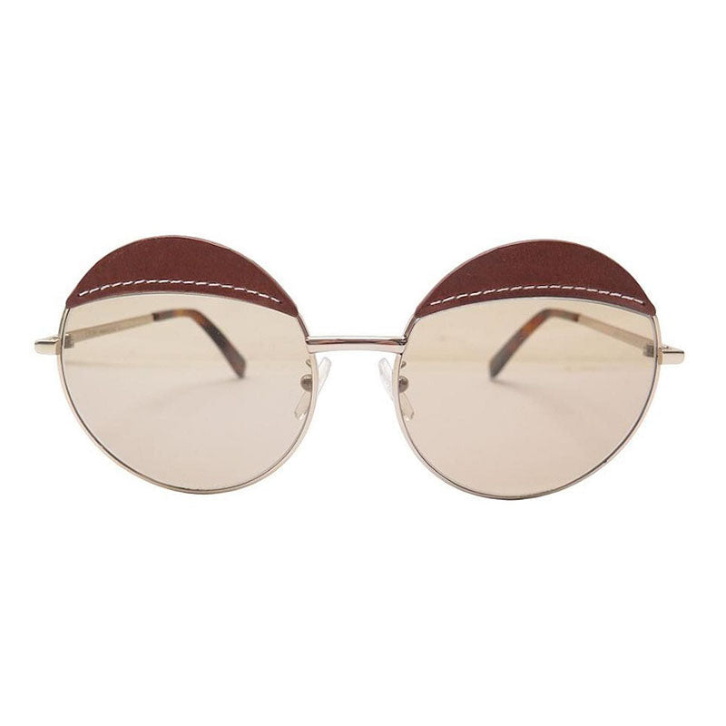Loewe Round Full Rim, with a Gold Brown Leather frame and Brown lens.