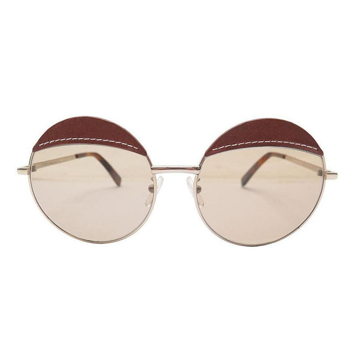 Loewe Round Full Rim, with a Gold Brown Leather frame and Brown lens.
