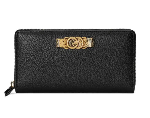 Black wallet with gold emblem on a white background