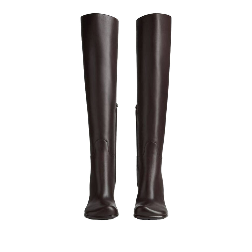 Pair of brown knee-high boots on a white background