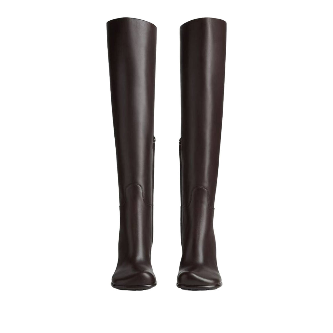 Pair of brown knee-high boots on a white background