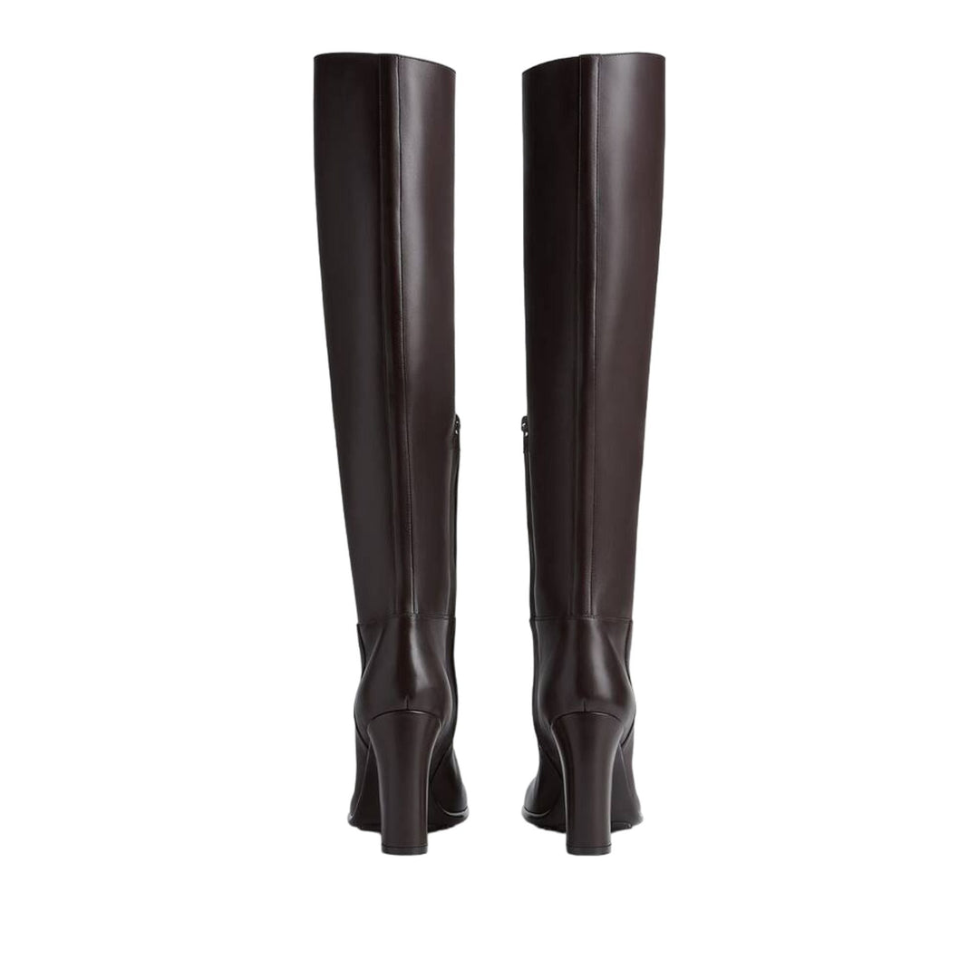 Pair of black knee-high boots on a white background