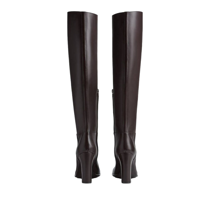 Pair of black knee-high boots on a white background