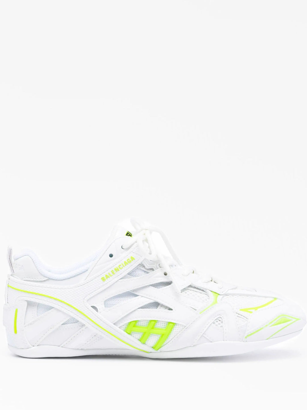 White sneaker with neon green accents on a white background