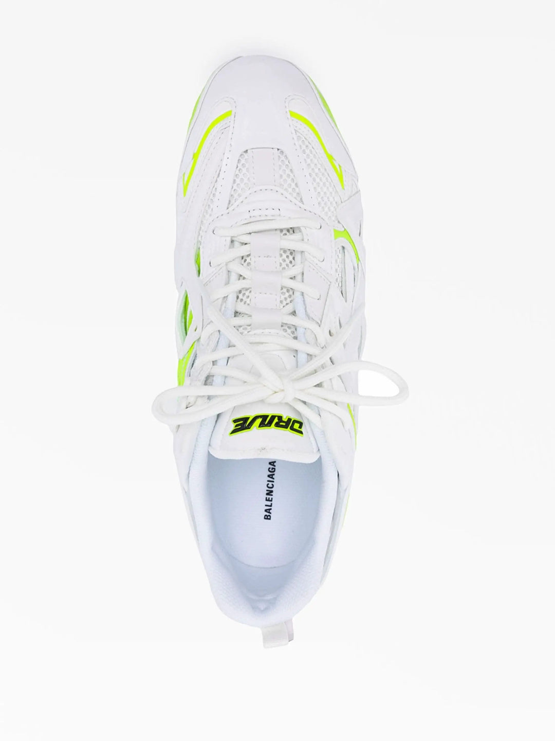 White sneaker with neon green accents on a white background