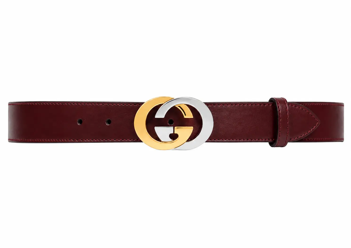 Brown belt with a gold and silver G buckle on a white background