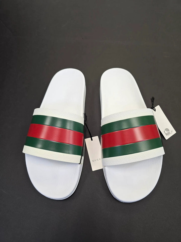 White slides with green and red stripes on a black background