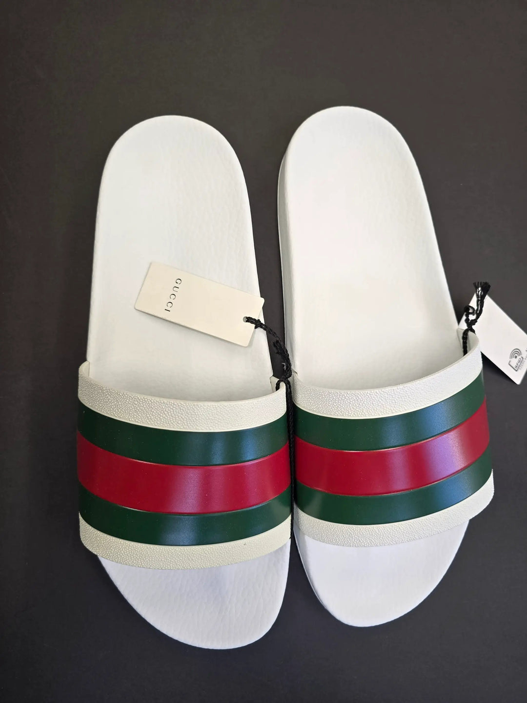 White slides with red and green stripes on a black background